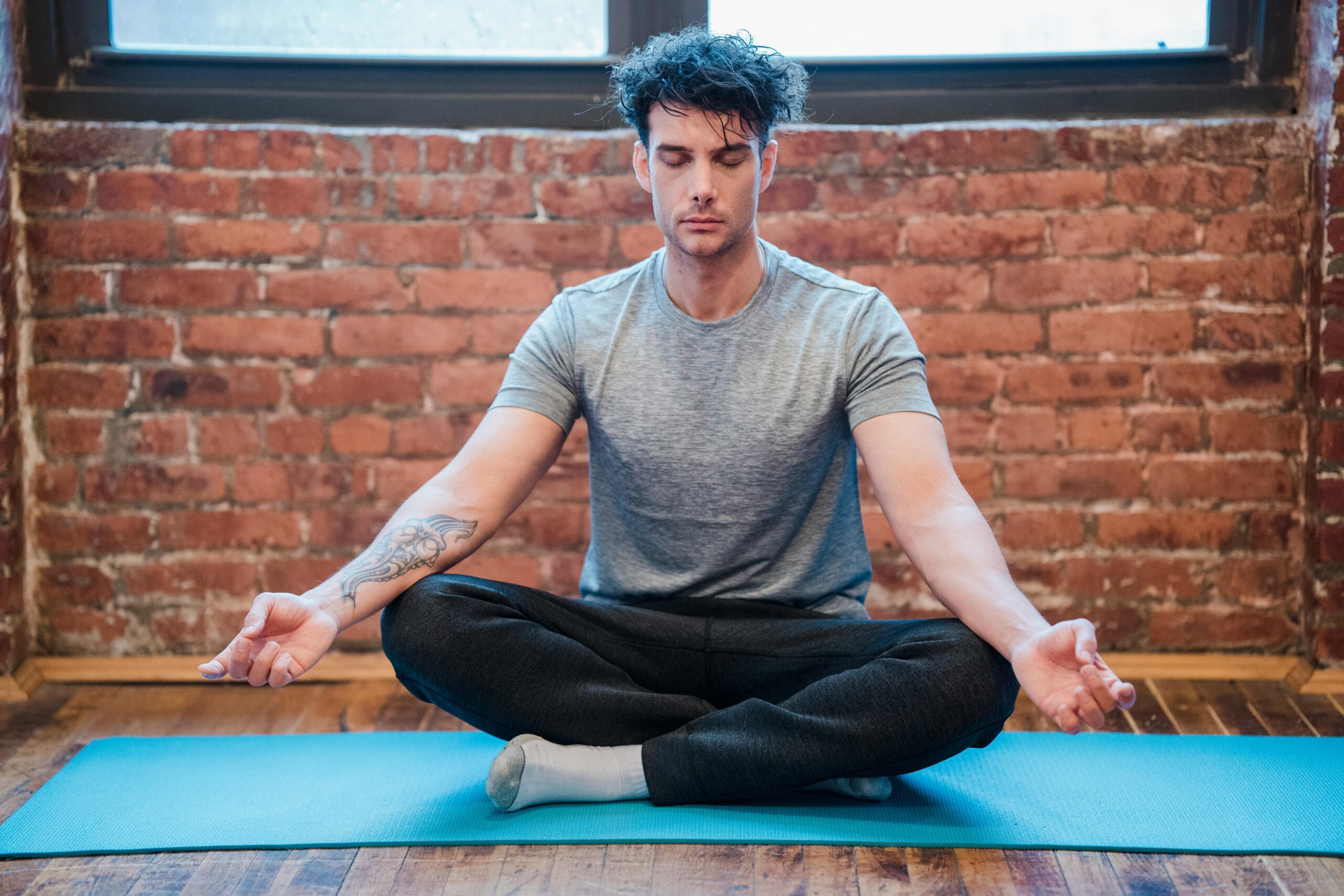 “man meditating as part of self-care for mental health.